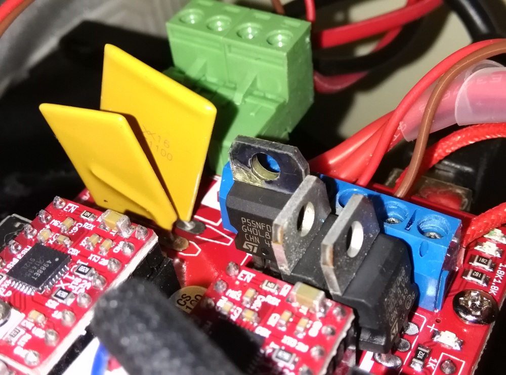 MOSFET showing heat fatigue. Different colour from the other 2 MOSFETs
