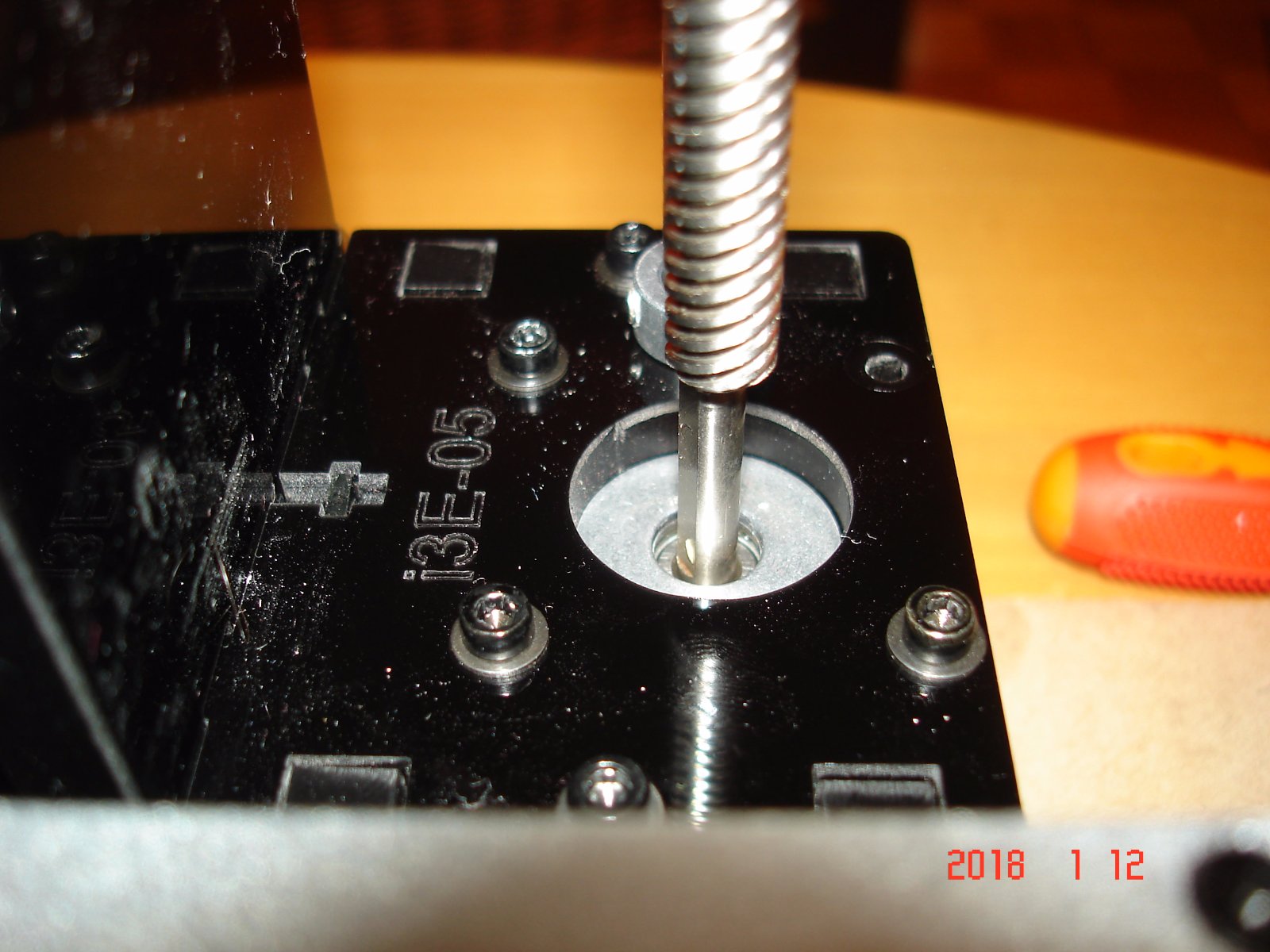 the axis of the screw and the stepper motor