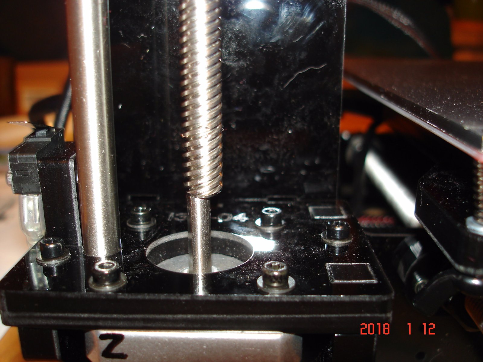 the axis of the screw and the stepper motor